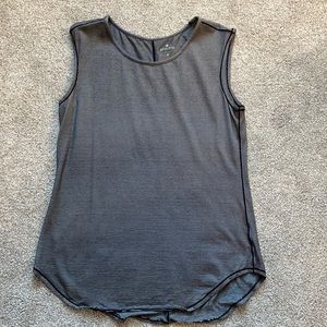 Very loose fitting black and white striped tank.